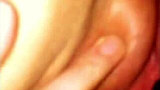 Fingering my wife to a pleasurable climax.