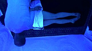 Gigi Breeze enjoys a blacklight massage.