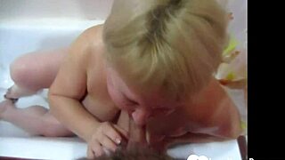 blonde enjoys a relaxing bath while sucking his cock