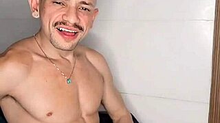 brendo vilhena masturbating hard on the bed, stroking his cock intensely