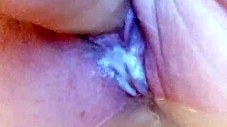 she says, watch me fuck my wet pussy with this dildo in the pool-like bathtub, creamy and solo.