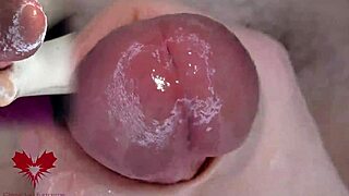 super close-up view of glans play with dilator in wild games.