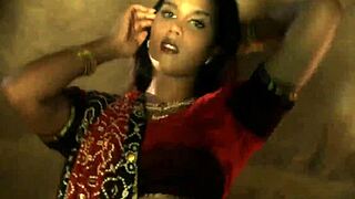 Eastern Indian dancer reveals her sensual moves in a solo performance. Her allure captivates every gaze.