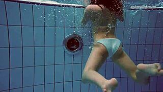 alla the russian brunette swims naked in the hot pool, her petite horny body smoking and glistening