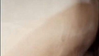 Maid relaxes inside the bedroom casually