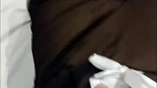 Maid relaxes inside the bedroom casually