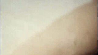 Maid relaxes inside the bedroom casually