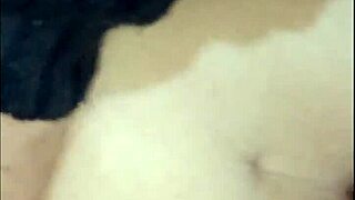 Maid relaxes inside the bedroom casually