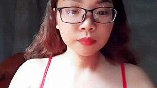 Em showcases big tits in a steamy display of raw action