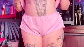 Hey, watch this curvy milf tease in silk pajamas! Isn't she hot?