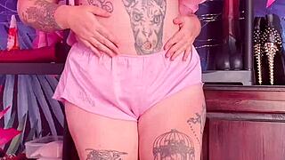 Hey, watch this curvy milf tease in silk pajamas! Isn't she hot?