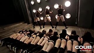 Girls dancing energetically in a lively setting with hot moves