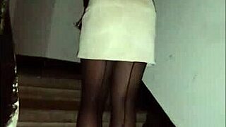 leather catsuit or pantyhose with miniskirt, femdom fetish vibes