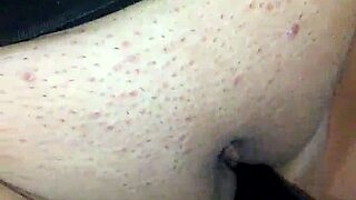 Bound Woman Uses Black Dildo While Masked