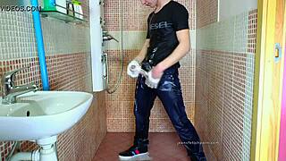 Gay guy in wet jeans showers, fetish masturbating his dick part 2. He contrasts the cold water with his hot arousal.