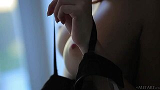 MetArt showcases redhead babe Michelle H undressing in a sensual solo display.