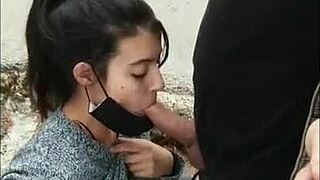 I's that brunette babe givin' a hot blowjob on the street, riskin' gettin' caught