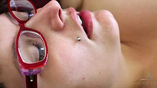 Betty, a curvy woman with glasses, enjoys a relaxing solo session