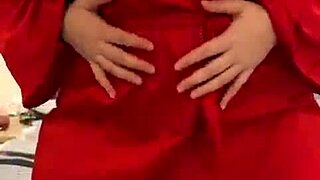 she says, look at me in this red lingerie, touching my big tits.