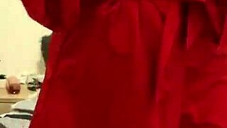 she says, look at me in this red lingerie, touching my big tits.