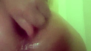 Feeling intense pleasure as I fuck my ass with a dildo in the shower