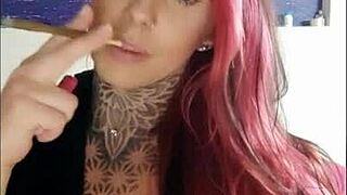 Tattooed wife smoking on webcam