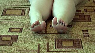 A curvy girl in pantyhose explores her legs with passion.