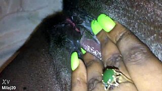 Fingering my tight black creamy pink pussy, feeling every wet touch as an old ebony woman craves more.