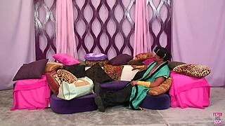 One bimbo shares a kiss with another after getting her mouth filled