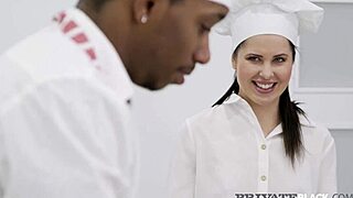 Yo, blue-eyed brunette grips big black cock with both hands in kitchen action!