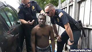 Two police officers corner a black guy in the office, taking turns with his cock in a heated interracial encounter