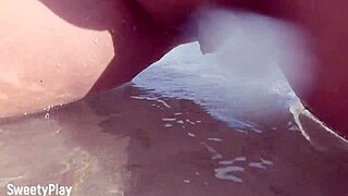 Chubby babe with shaved pussy caught peeing on public beach.