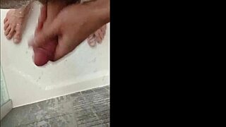 Blonde bodybuilder showers muscular cock with blue eyes!