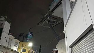 tranny flashes in public cablebus exhibit with bold outdoor display