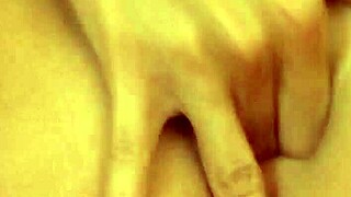 Beautiful girl masturbating on sofa during webcam session