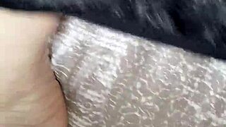 Why is Gretala rubbing her thong on her feet?