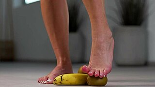Petite Brunette Girl Crushes Fruits Under High Heels in Hot Foot Fetish Scene
