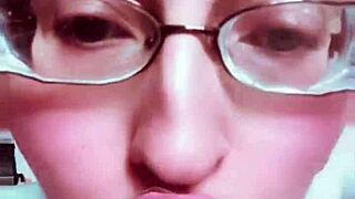 The goddess with huge glasses and nude lipstick enslaves you in kinky BDSM