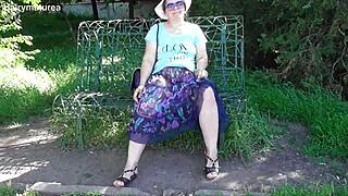 Hairy mature struts outdoors in a see-through dress