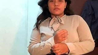 Asian woman performs strip tease