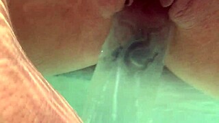 Descriptive Underwater Creampie with Dildo in Shaved Babe's Pussy Close Up