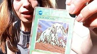 Bonneyuwu Shows Off Her Body in Cosplay While Displaying Cards Outdoors.