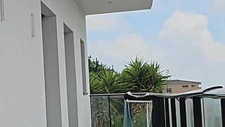 fooling around with tommy cabrio on the balcony as neighbors stare