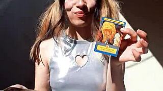 Bonneyuwu Shows Off Her Body in Cosplay While Displaying Cards Outdoors.