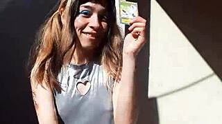 Bonneyuwu Shows Off Her Body in Cosplay While Displaying Cards Outdoors.