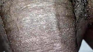 Just a man casually playing with his huge black cock