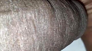 Just a man casually playing with his huge black cock