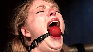 Strapped and Gagged Brunette Sub Rides Sybian for Intense Action