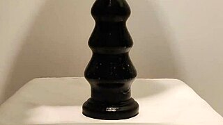 latexi69 engages in intense butt plug play with latex gear, exploring anal sensations