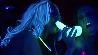 cute lesbians lick pussy at party with glowing toys.